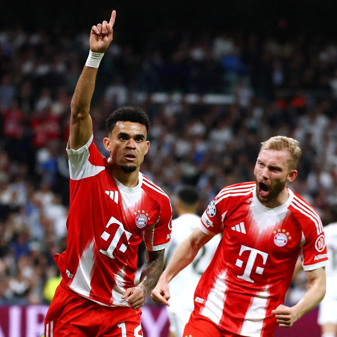 Soccer Football - UEFA Champions League - Quarter Final - First Leg - Real Madrid v Bayern Munich - Santiago Bernabeu, Madrid, Spain - April 7, 2026 Bayern Munich's Luis Diaz celebrates scoring their first goal REUTERS/Gonzalo Fuentes