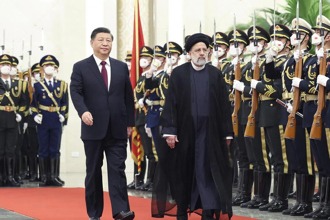 Chinese President Xi Jinping (L) holds a welcoming ceremony for visiting Iranian President Ebrahim Raisi (R) at the Great Hall of the People in Beijing, China on Feb 14, 2023. 