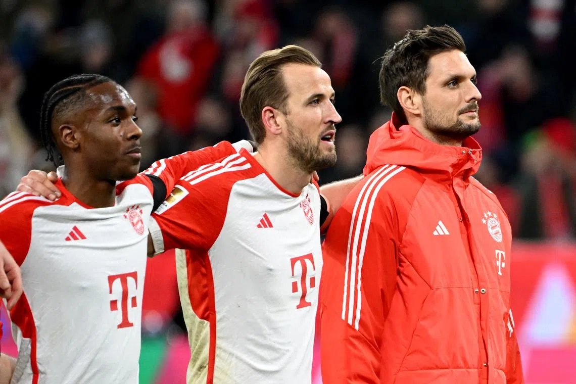 Soccer Football - Bundesliga - Bayern Munich v RB Leipzig - Allianz Arena, Munich, Germany - February 24, 2024 Bayern Munich's Harry Kane, Mathys Tel and Sven Ulreich celebrate after the match REUTERS/Angelika Warmuth/ File Photo