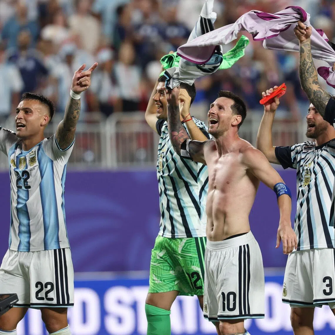 (L-R) Argentina's forward #22 Lautaro Martinez, goalkeeper #12 Geronimo Rulli, forward #10 Lionel Messi, defender #03 Nicolas Tagliafico and midfielder #05 Leandro Paredes celebrate the 3-1 victory over Switzerland during the 2026 World Cup football tournament quarter-final match between Argentina and Switzerland at the Kansas City Stadium in Kansas City on July 11, 2026.  (Photo by Odd ANDERSEN / AFP)