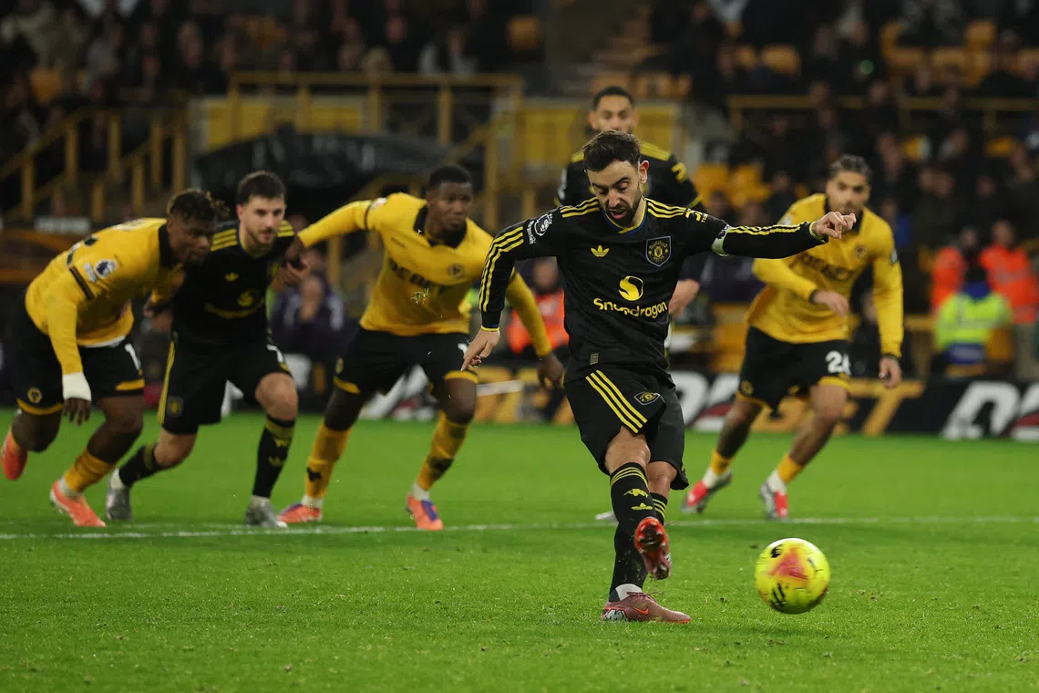 Soccer Football - Premier League - Wolverhampton Wanderers v Manchester United - Molineux Stadium, Wolverhampton, Britain - December 8, 2025 Manchester United's Bruno Fernandes scores their fourth goal from the penalty spot REUTERS/Phil Noble