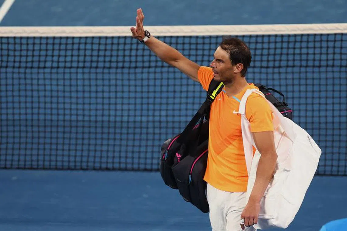 Tennis - Australian Open - Melbourne Park, Melbourne, Australia - January 18, 2023 Spain's Rafael Nadal acknowledges fans as he leaves the court after losing his second round match against Mackenzie Mcdonald of the U.S. REUTERS/Hannah Mckay/File Photo
