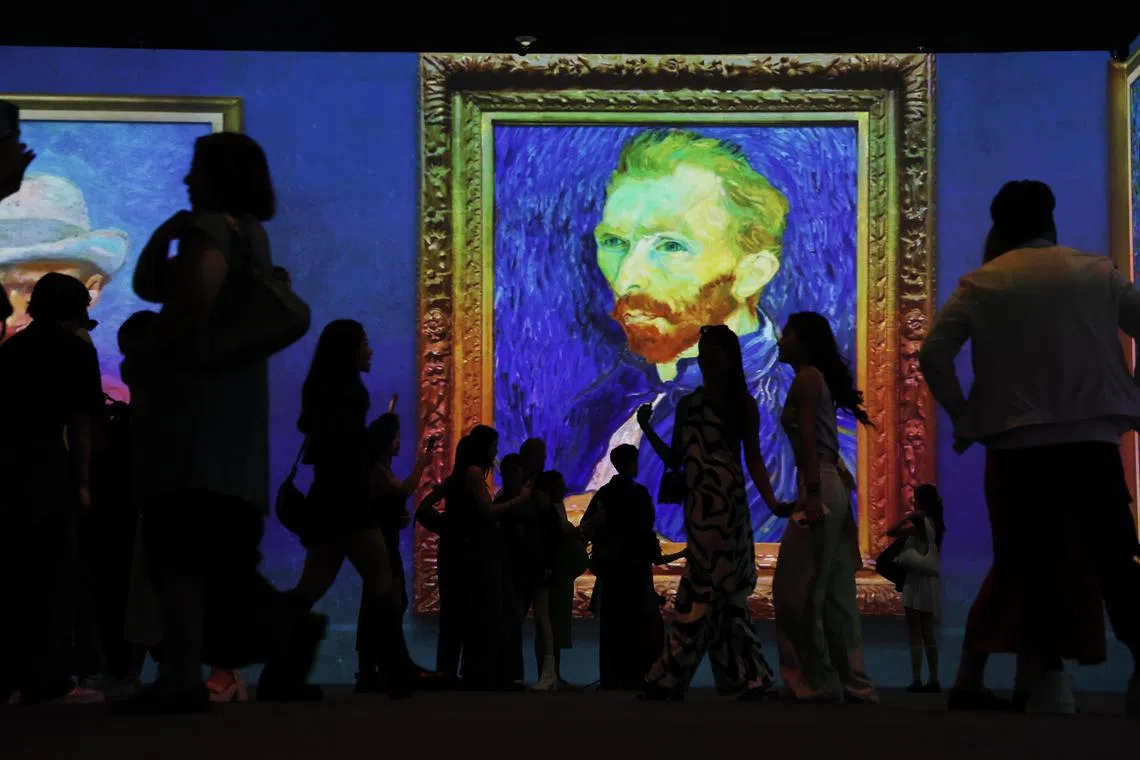 ST20250123_202528200137/pixdigitalart/Brian Teo/Invited guests exploring the Van Gogh INSIDE: Love, Vincent digital art exhibition during the preview at Parkview Square on Jan 23, 2025. It is one of two new immersive experiences, with the other being Gustav Klimt: Timeless Beauty, unveiled by GROUNDSEESAW, a digital art exhibition brand by Seoul-based Media & Art Co., Ltd. Set across five screens—each over six meters high—the theatrical experience is designed to immerse guests in the colourful worlds of these iconic artists. Alongside the existing Monet Inside exhibition, the digital art displays will rotate daily. ST PHOTO: BRIAN TEO 