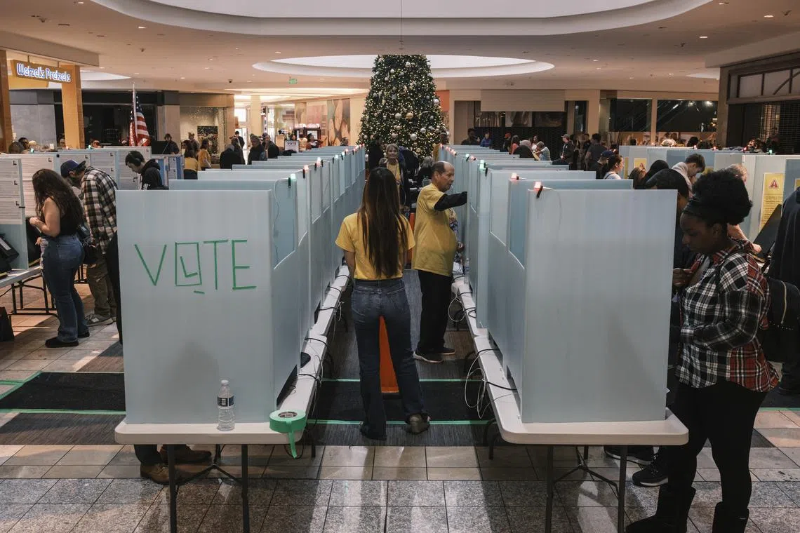 Voters and poll workers at a polling location inside a shopping mall in Henderson, Nevada, on Election Day, on Nov 5.
