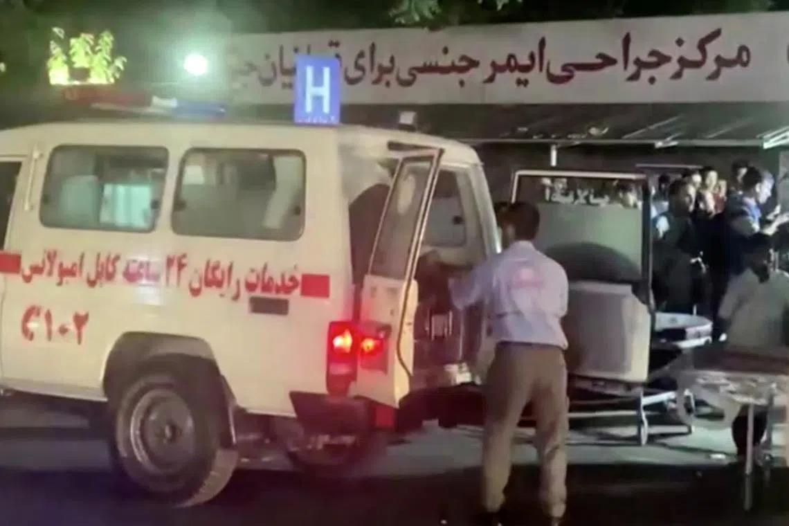 A screen grab shows an emergency vehicle as people arrive at a hospital after an attack at Kabul airport, in Kabul, Afghanistan August 26, 2021. REUTERS TV/via REUTERS