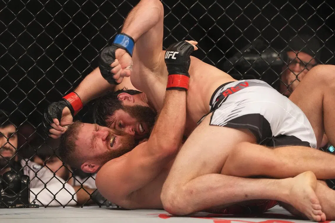 Jan Blachowicz (red gloves) fighting Magomed Ankalaev during UFC 282 at T-Mobile Arena in Las Vegas on Sunday. The Ultimate Fighting Championship’s light heavyweight crown will remain vacant after the bout was called as a controversial split draw.
