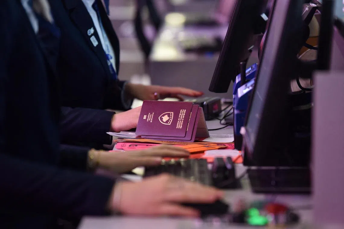 Kosovo passports lie on a check-in counter at Pristina Airport, as Kosovo citizens start to travel to Schengen area without a visa for the first time, near Pristina, Kosovo January 1, 2024.  REUTERS/Laura Hasani
