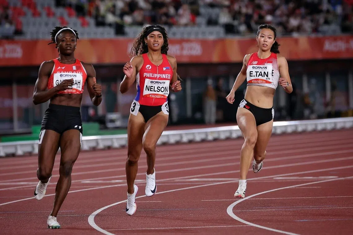 Elizabeth Tan (right) of Singapore in action during the Asian Games Athletics Women?s 100m semi-final at the Paloma Mizuho Stadium in Nagoya, Japan on Sept 25, 2026. ST PHOTO: KEVIN LIM pixag25