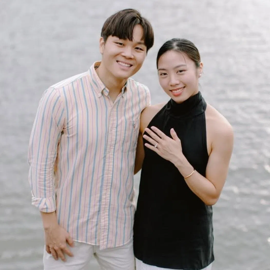 Yeo Jia Min showing a sparkling ring on her ring finger, with Pang Sheng Jun by her side.