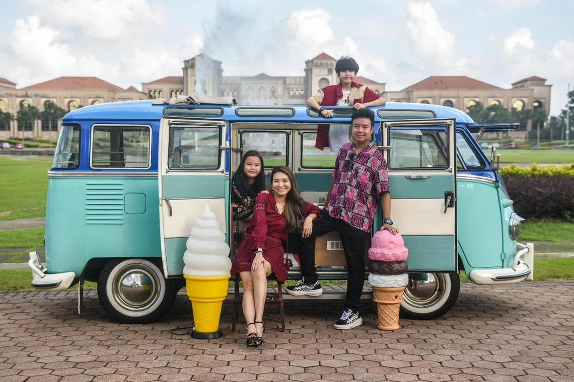 astobias - Tobias Peng with his wife Sheryl Quek, daughter Brea (far left) and son Axel in a photo taken in 2024 in Johor, Malaysia featuring his 1956 Volkswagen T1 Deluxe Kombi van with Sunroof. PHOTO CREDIT : ZO TAN PHOTOGRAPHY