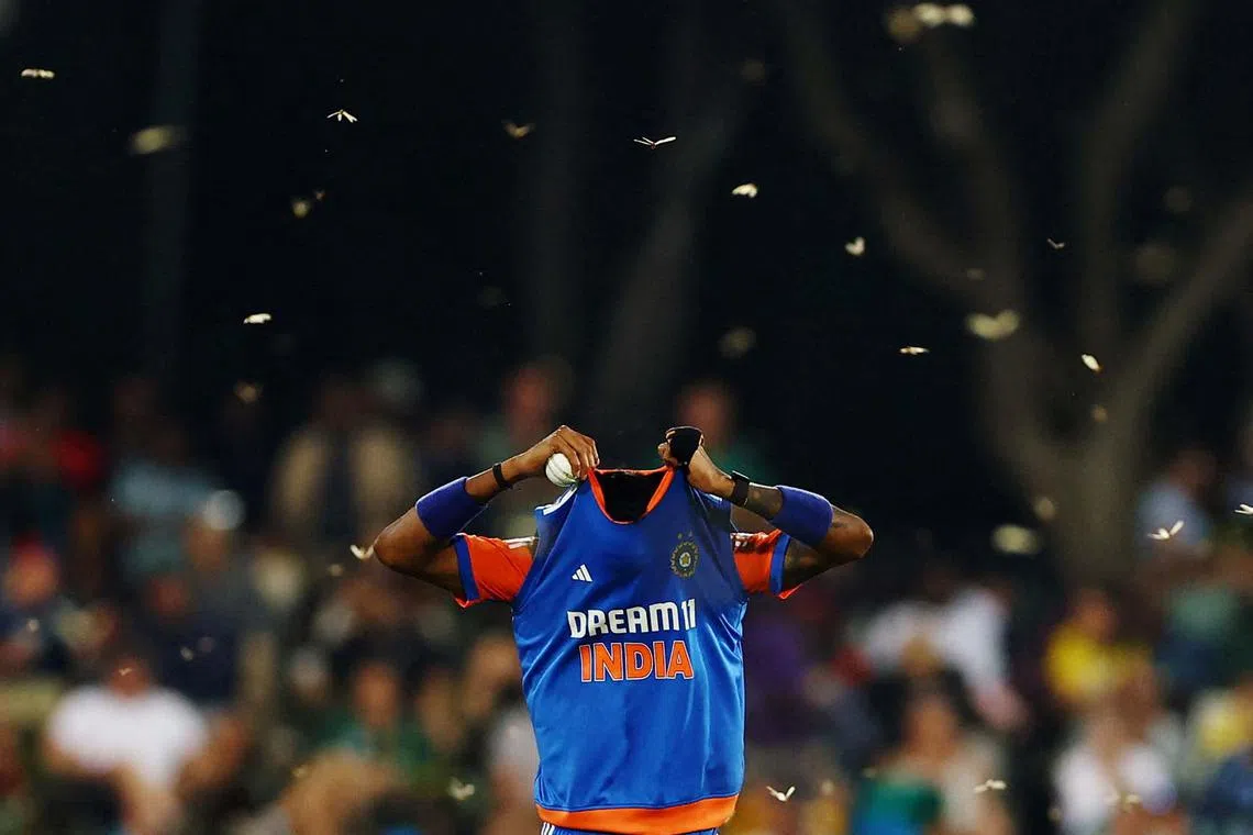 India's Hardik Pandya is surrounded by flying ants leading to play being stopped during a cricket match between South Africa and India at Centurion Park in South Africa, Nov 13, 2024.