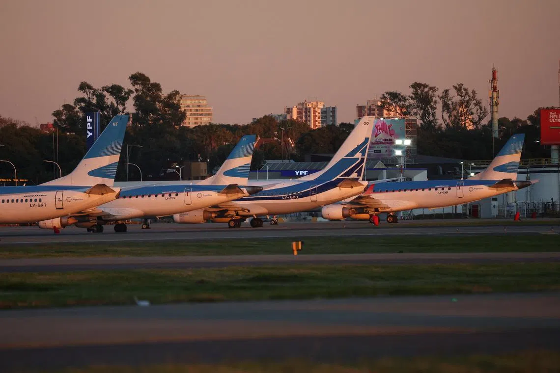 FILE PHOTO: A view of Aerolineas Argentinas planes, at Aeroparque Jorge Newbery airport, during a 24-hour general strike against Argentina's President Javier Milei government's adjustment policy, in Buenos Aires, Argentina May 9, 2024. REUTERS/Agustin Marcarian/File Photo