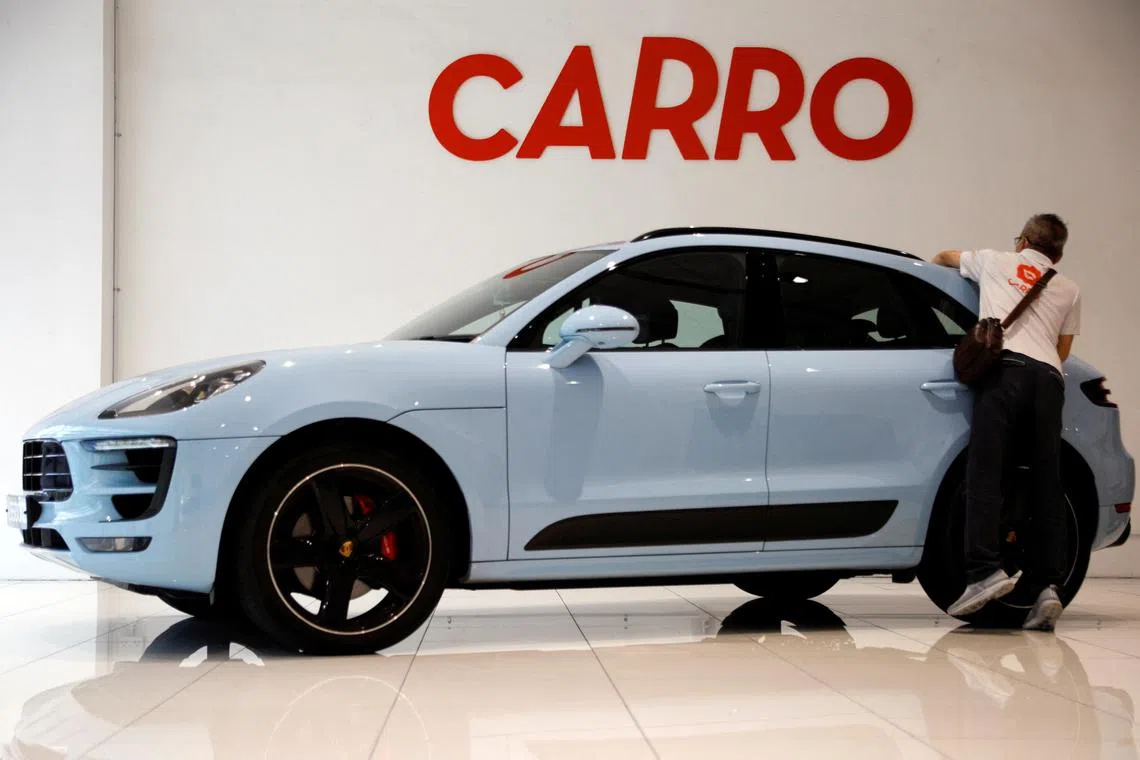 FILE PHOTO: FILE PHOTO: A view of the Carro signage at their showroom in Singapore June 15, 2021.   REUTERS/Edgar Su/File Photo