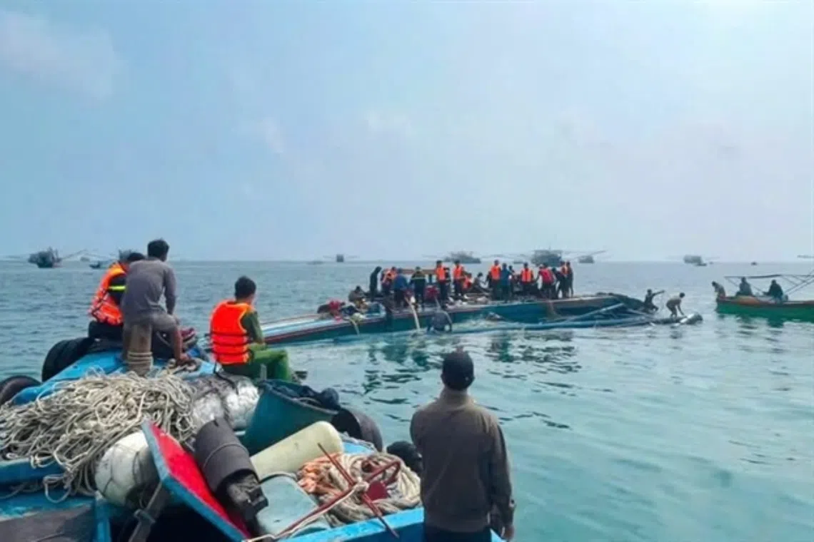 Authorities and local fishermen search for a worker missing after a fishing boat capsized near Phu Quy Island on Sept 15.