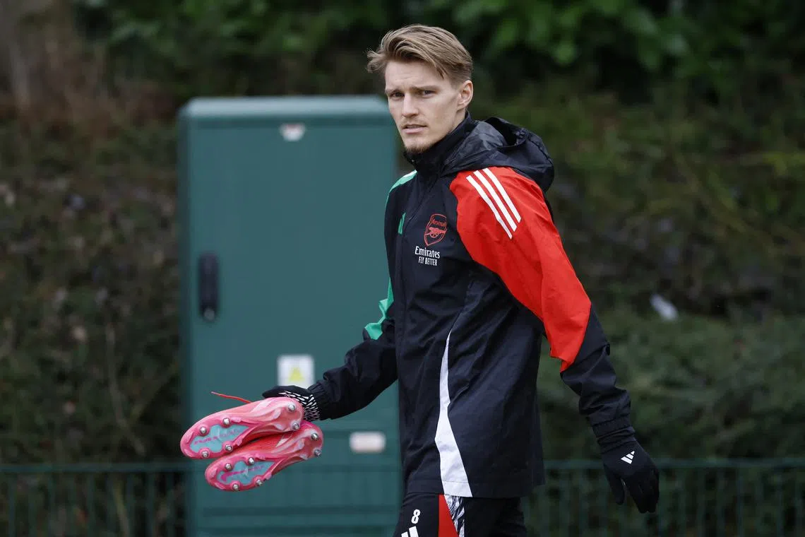 FILE PHOTO: Soccer Football - Champions League - Arsenal Training - Arsenal Training Centre, London Colney, Britain - January 28, 2025 Arsenal's Martin Odegaard during training Action Images via Reuters/Peter Cziborra/File Photo