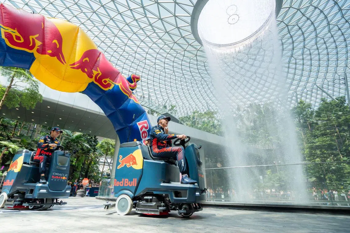 Red Bull Racing’s Max Verstappen (right) and Sergio Perez taking on ‘The World’s Cleanest Race’ at Jewel Changi Airport on Sept 15, 2023.