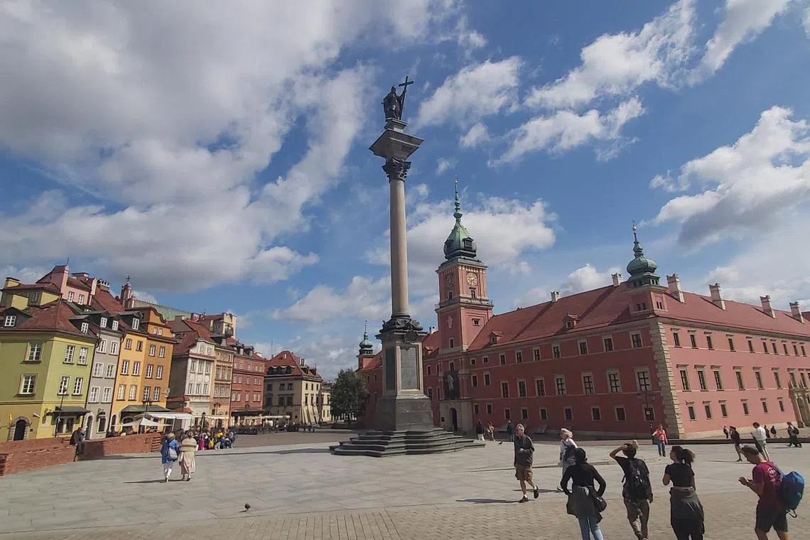 hopoland - hopoland/possible main pic for feature/A wide view of Warsaw's Castle Square in its Old Town, featuring the Royal Palace (right) and Sigismund Column, which bears a statute of King Sigismund III Vasa, who made the decision to move Poland's capital from Krakow to Warsaw in 1596. PIC: HO AI LI