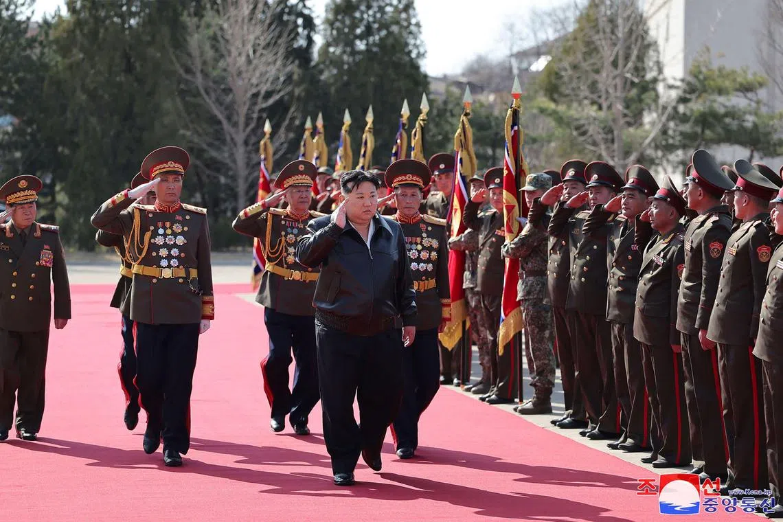 Mr Kim (centre) inspecting the headquarters of the Seoul Ryu Kyong Su Guards 105th Tank Division of the Korean People's Army (KPA) at an undisclosed location in North Korea.