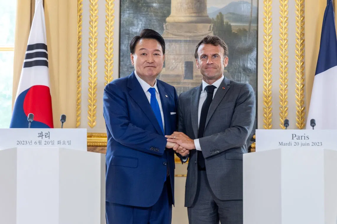 South Korean President Yoon Suk-yeol and French President Emmanuel Macron at a joint press conference at Elysee Palace in Paris, on June 20.