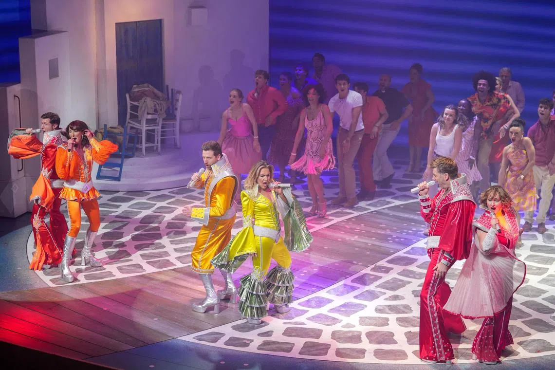 Cast members performing during the curtain call for Mamma Mia, as the musical celebrates 25 years, at the Novello Theatre in London, on April 6. 