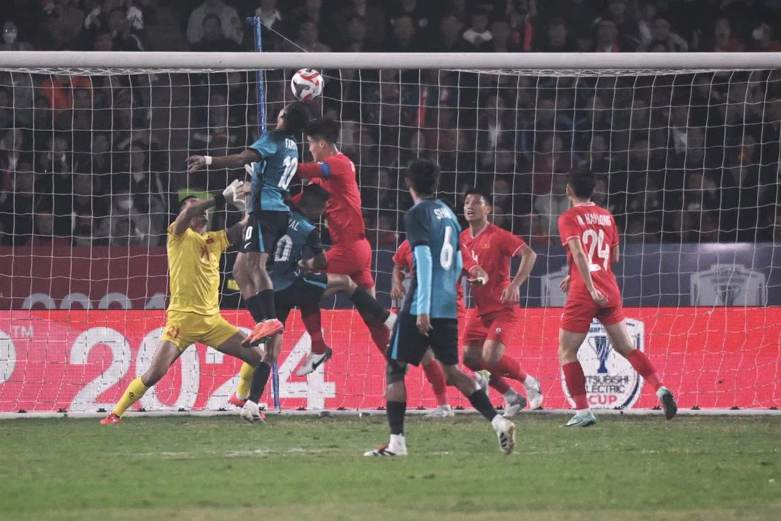 Singapore's Faris Ramli heading in a goal against Vietnam which was later disallowed.