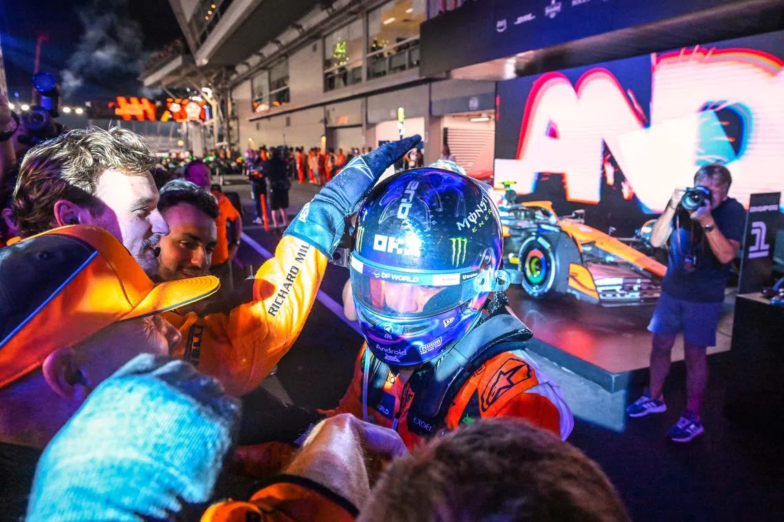 Lando Norris thanking his operation staff after winning the Formula One Singapore Airlines Grand Prix on Sept 22, 2024. 