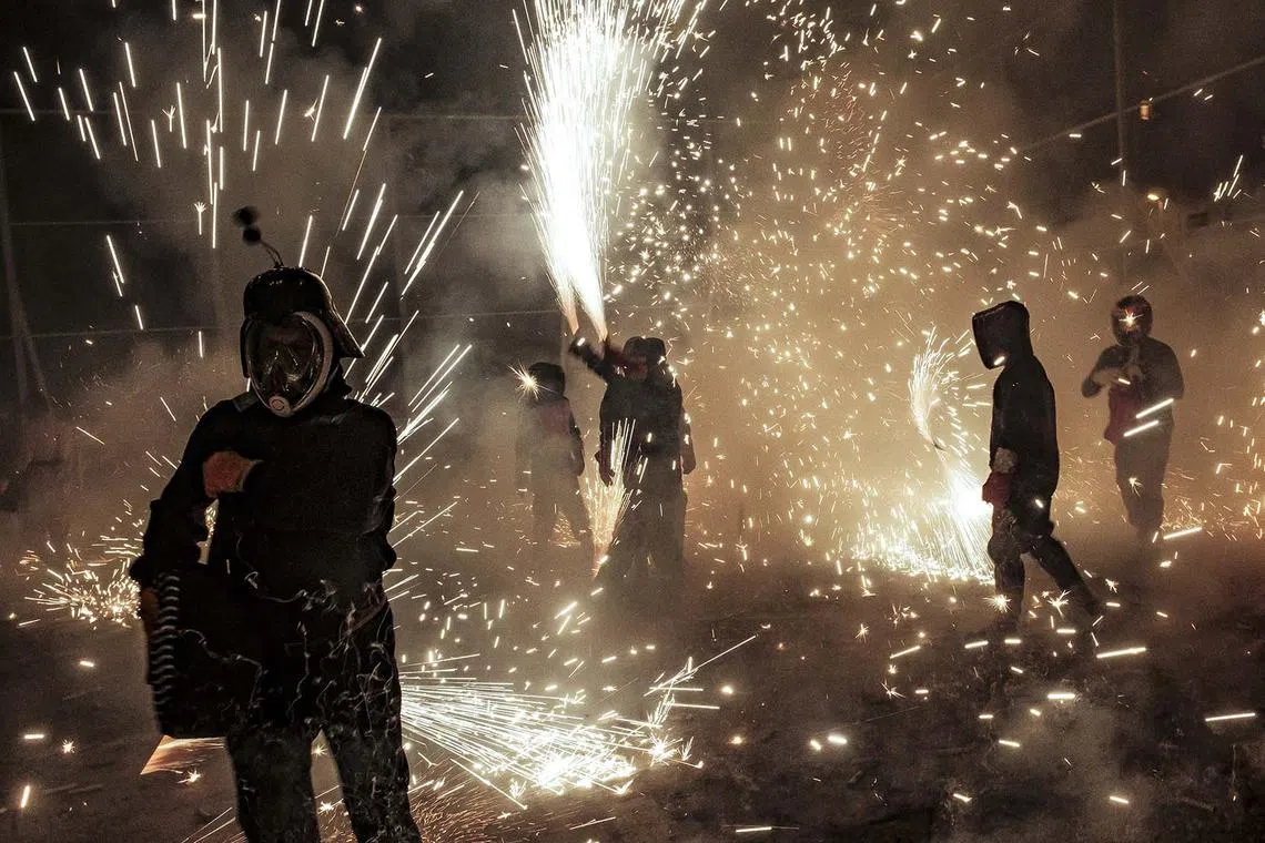 Revelers taking part in the 'Nit de l'Alba' (Night of Dawn) traditional festivities in the city of Elche, Spain, Aug 13, 2024.