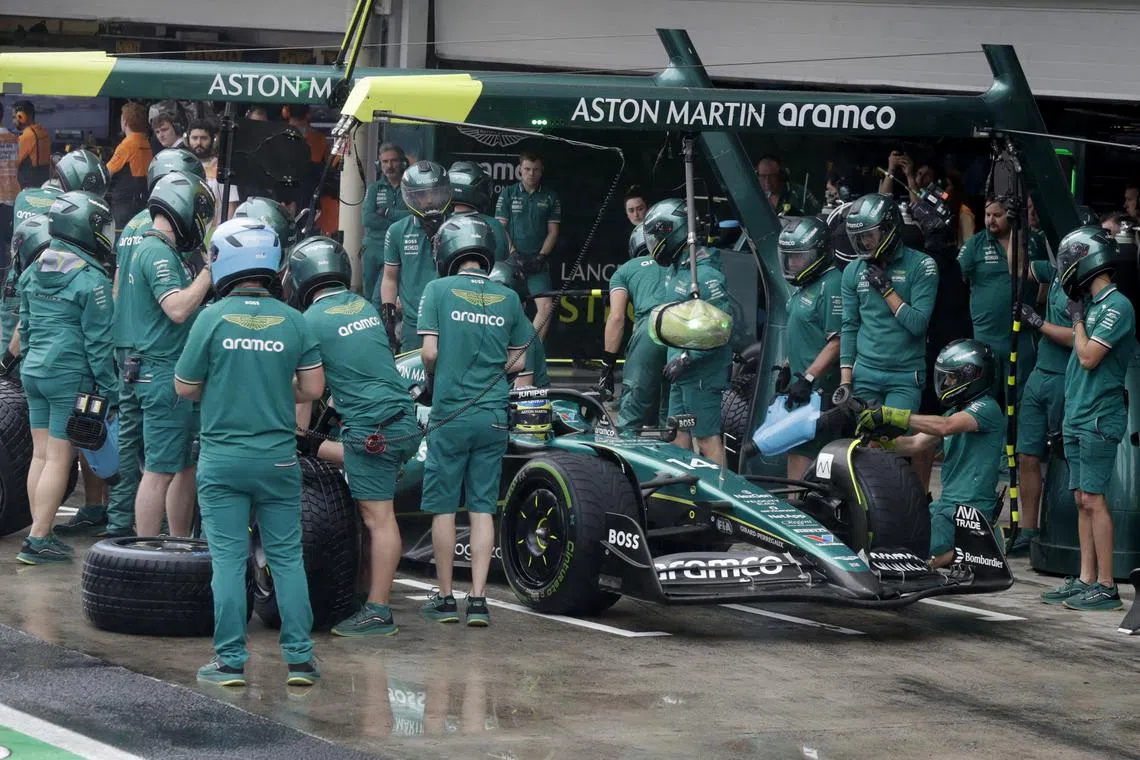 Formula One F1 - Sao Paulo Grand Prix - Autodromo Jose Carlos Pace, Sao Paulo, Brazil - November 3, 2024 Mechanics work on the car of Aston Martin's Fernando Alonso during qualifying Pool via REUTERS/Sebastiao Moreira/File Photo