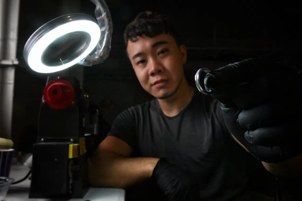 Andrew Lim, 31, principal photographer of Drewperspectives Underwater photographer by day, creator of cremation rings on the side. He specialises in underwater photography.
