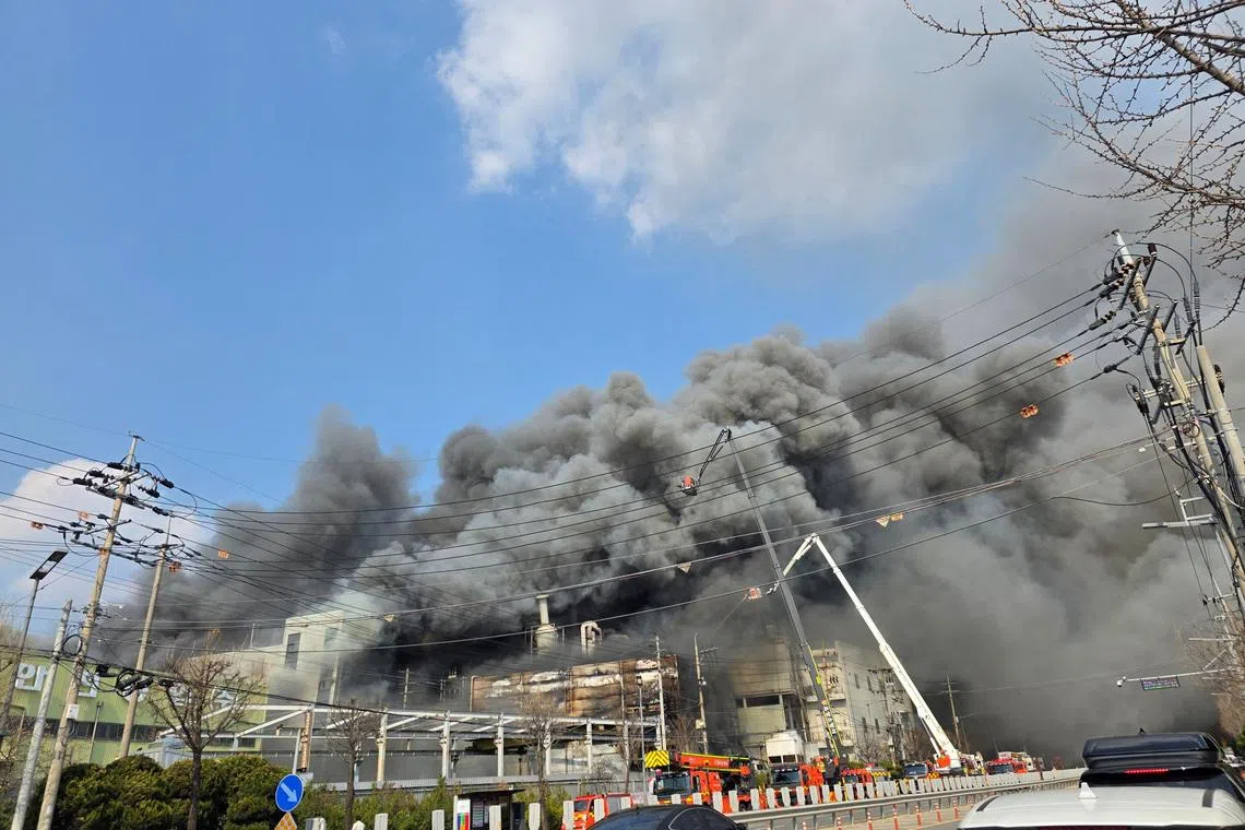 Firefighters were struggling to contain the fire as one of the two buildings affected had collapsed.