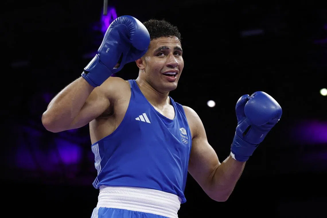Paris 2024 Olympics - Boxing - Men's +92kg - Prelims - Round of 16 - North Paris Arena, Villepinte, France - July 29, 2024. Delicious Orie of Britain reacts during his fight against Davit Chaloyan of Armenia. REUTERS/Peter Cziborra