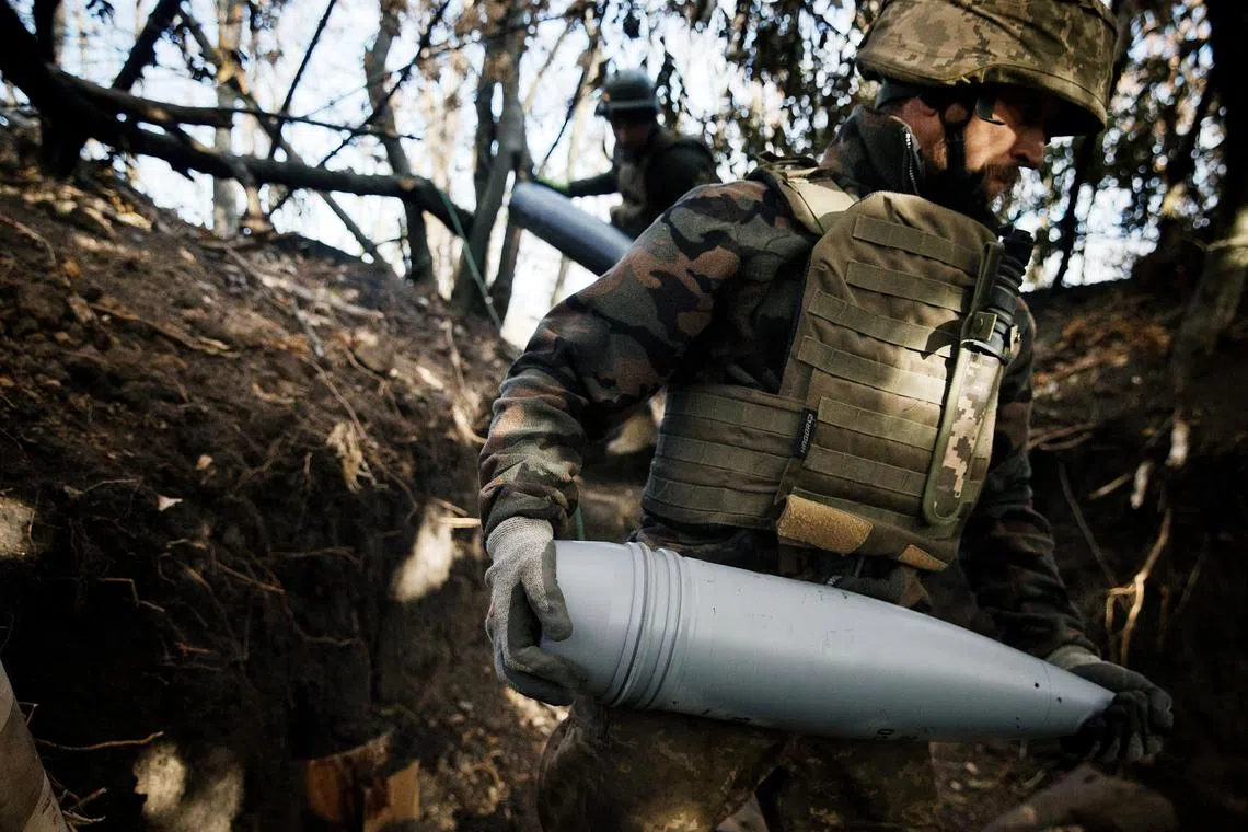 Ukrainian soldiers preparing to fire artillery at advancing Russian troops in the Pokrovsk region of Ukraine.