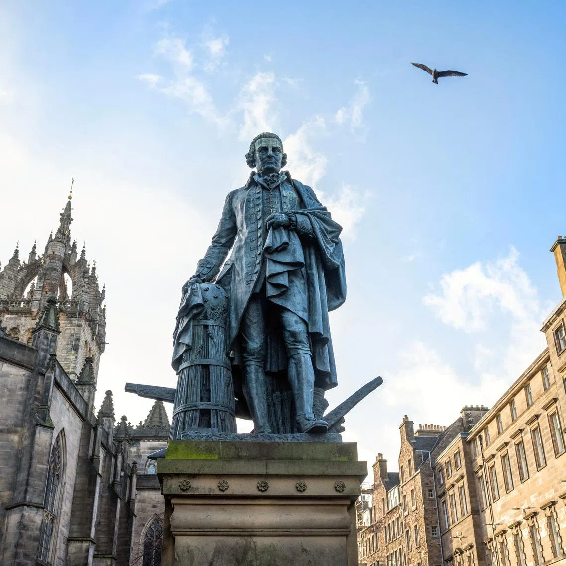 The bronze statue of Adam Smith, renowned economist and philosopher, located on the Royal Mile, positioned just outside St Giles' Cathedral in Edinburgh, Scotland, Britain February 20, 2026. REUTERS/Lesley Martin