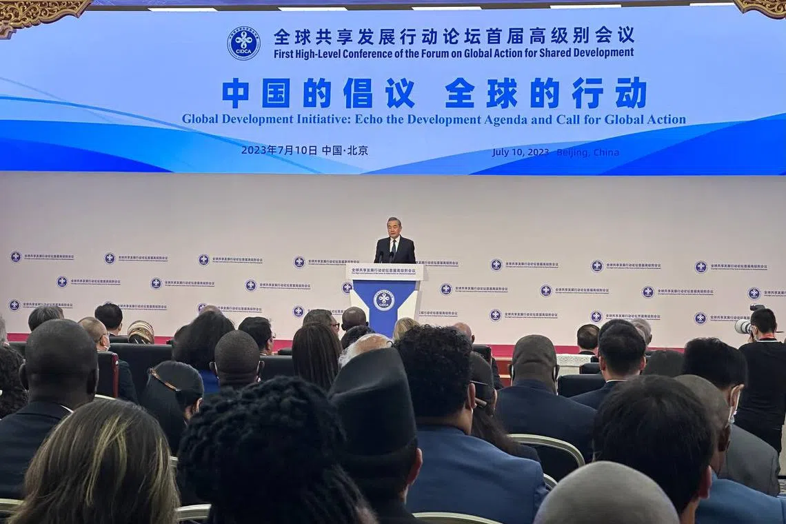 China's top diplomat Wang Yi speaking at an international forum held at the Beijing Friendship Hotel on Monday.