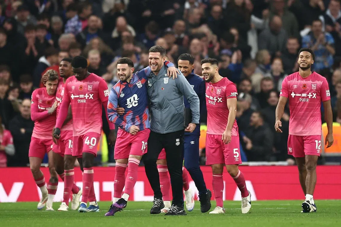 Ipswich's players celebrate at the end of the match between Tottenham Hotspur and Ipswich Town.