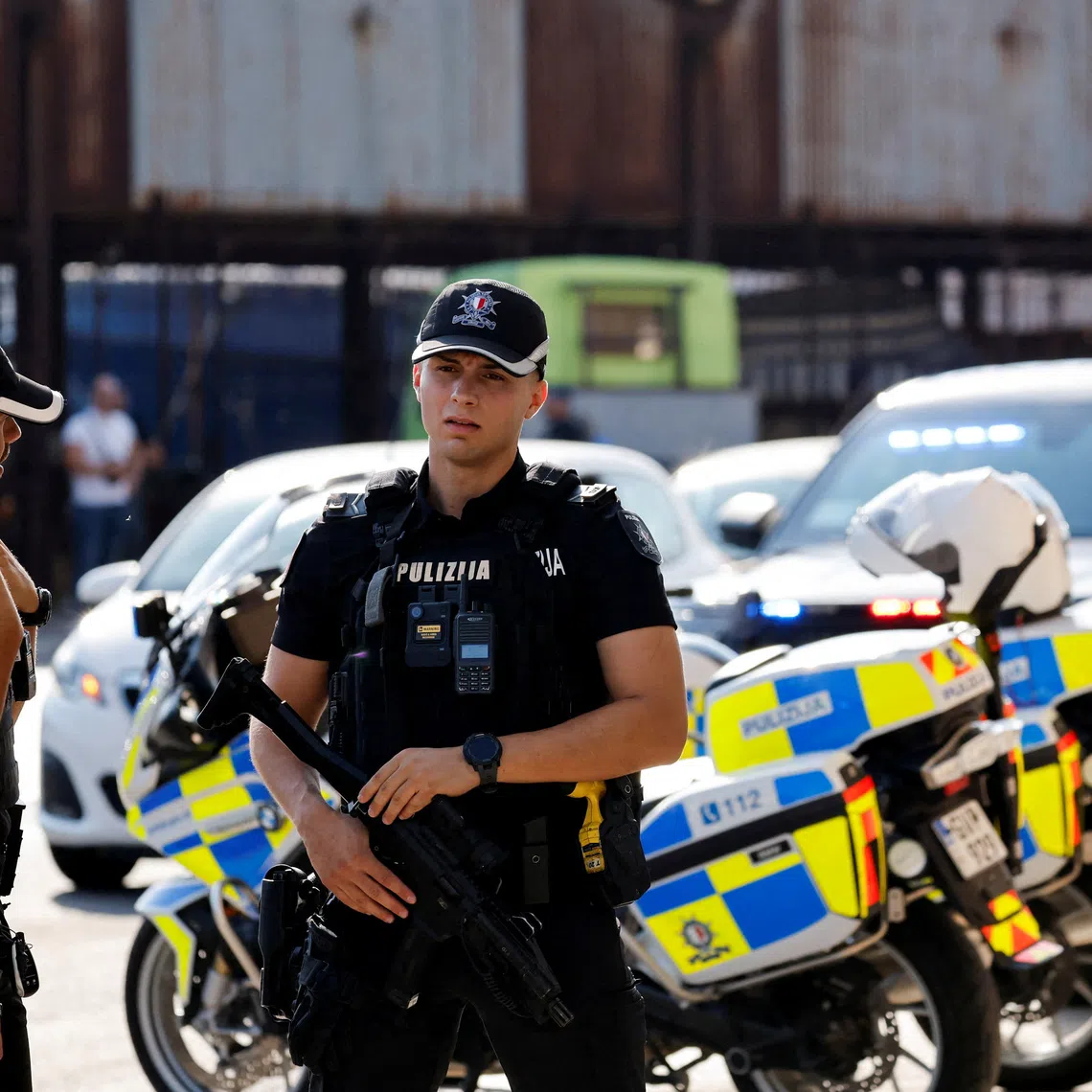 FILE PHOTO: Armed police officers provide security during a court on-site visit to the hitmen's hideout during the trial of alleged mastermind Yorgen Fenech, accused of conspiracy to murder journalist Daphne Caruana Galizia in 2017, in Marsa, Malta, August 14, 2026. REUTERS/Darrin Zammit Lupi/File Photo