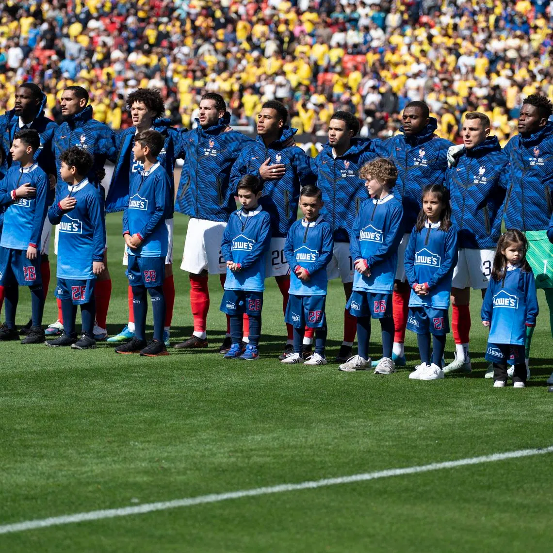 Mar 29, 2026; Landover, Maryland, USA;  France poses starting eleven stands on the field before an international friendly match Colombia at Northwest Stadium. Tommy Gilligan-Imagn Images