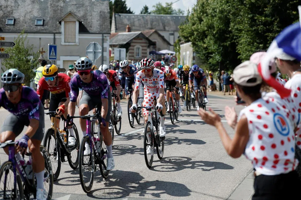 Cycling - Tour de France - Stage 9 - Chinon to Chateauroux - Chinon, France - July 13, 2025 UAE Team Emirates XRG's Tim Wellens wearing the polka-dot jersey in action in the peloton during stage 9 REUTERS/Benoit Tessier