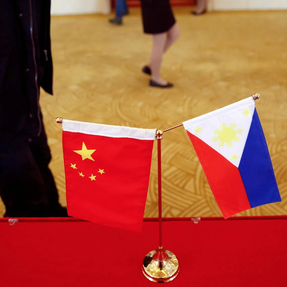 FILE PHOTO: National flags of China and the Philippines are seen in Beijing, China, January 23, 2017. REUTERS/Damir Sagolj/File Photo