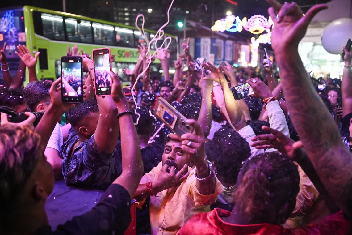 A group of people ushering in Deepavali near Campbell Lane shortly past midnight on Nov 12, 2023. 