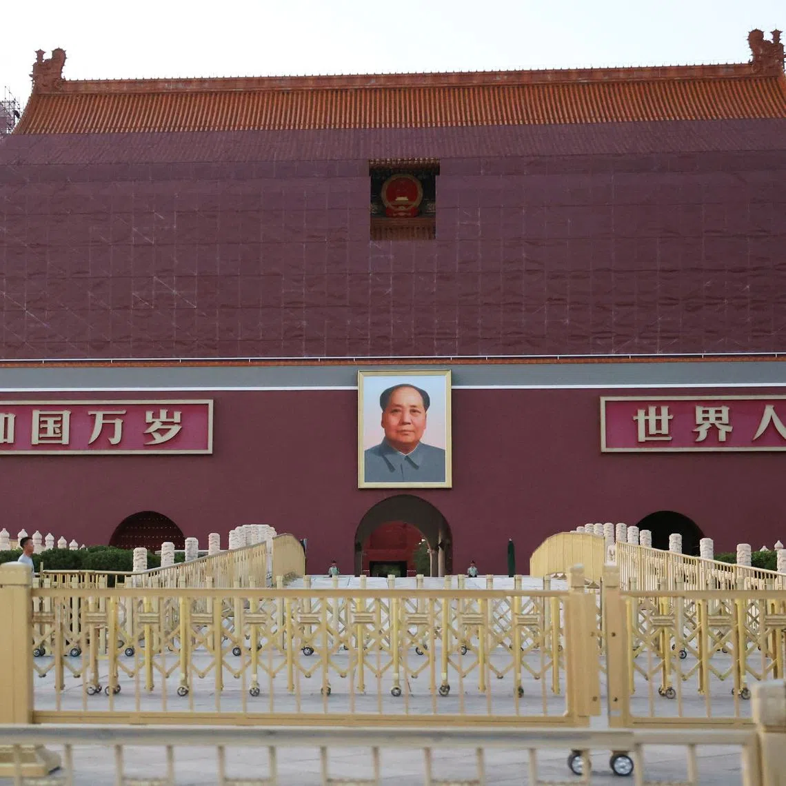 Security personnel keep watch near the portrait of late Chinese Chairman Mao Zedong displayed on the Tiananmen Gate, in Beijing, China June 3, 2025. REUTERS/Florence Lo