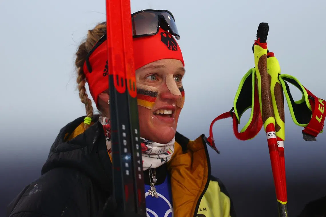 FILE PHOTO: 2022 Beijing Olympics - Cross-Country Skiing - Women's Team Sprint Classic Final - National Cross-Country Centre, Zhangjiakou, China - February 16, 2022.  Victoria Carl of Germany reacts after winning gold. REUTERS/Lindsey Wasson/File Photo