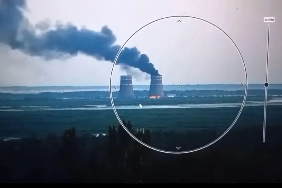 A video published by Zelensky showed black smoke billowing out of one of the station’s cooling towers as red flames licked around the bottom. 