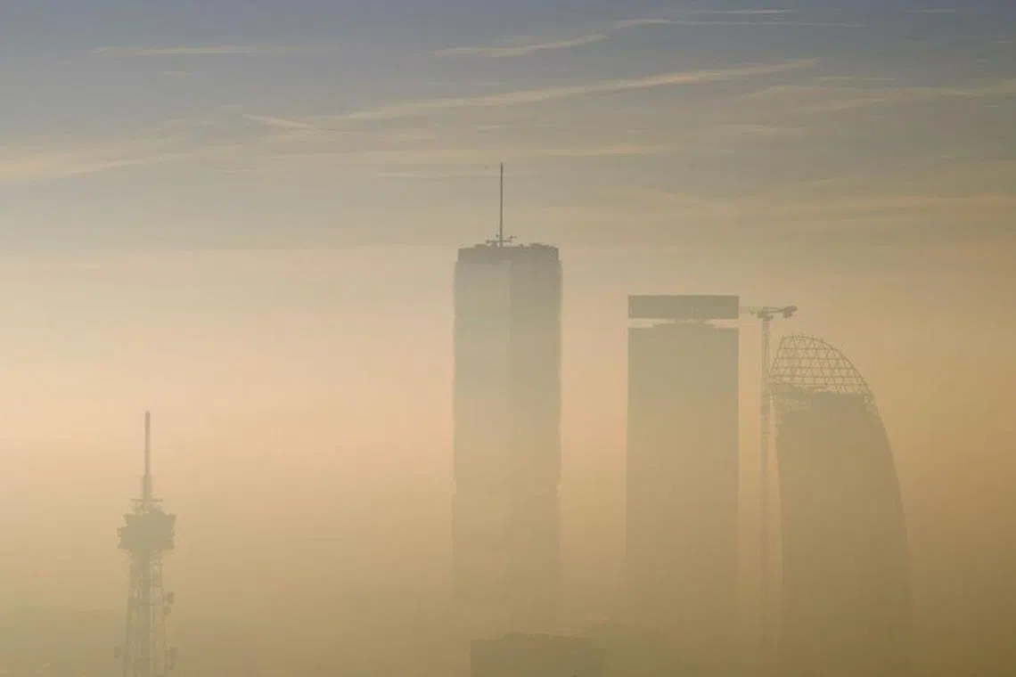 The Allianz Tower, the Libeskind Tower and the Generali Tower are pictured amidst dense fog and smog in Milan, Italy, January 8, 2020. REUTERS/Flavio Lo Scalzo/ File photo