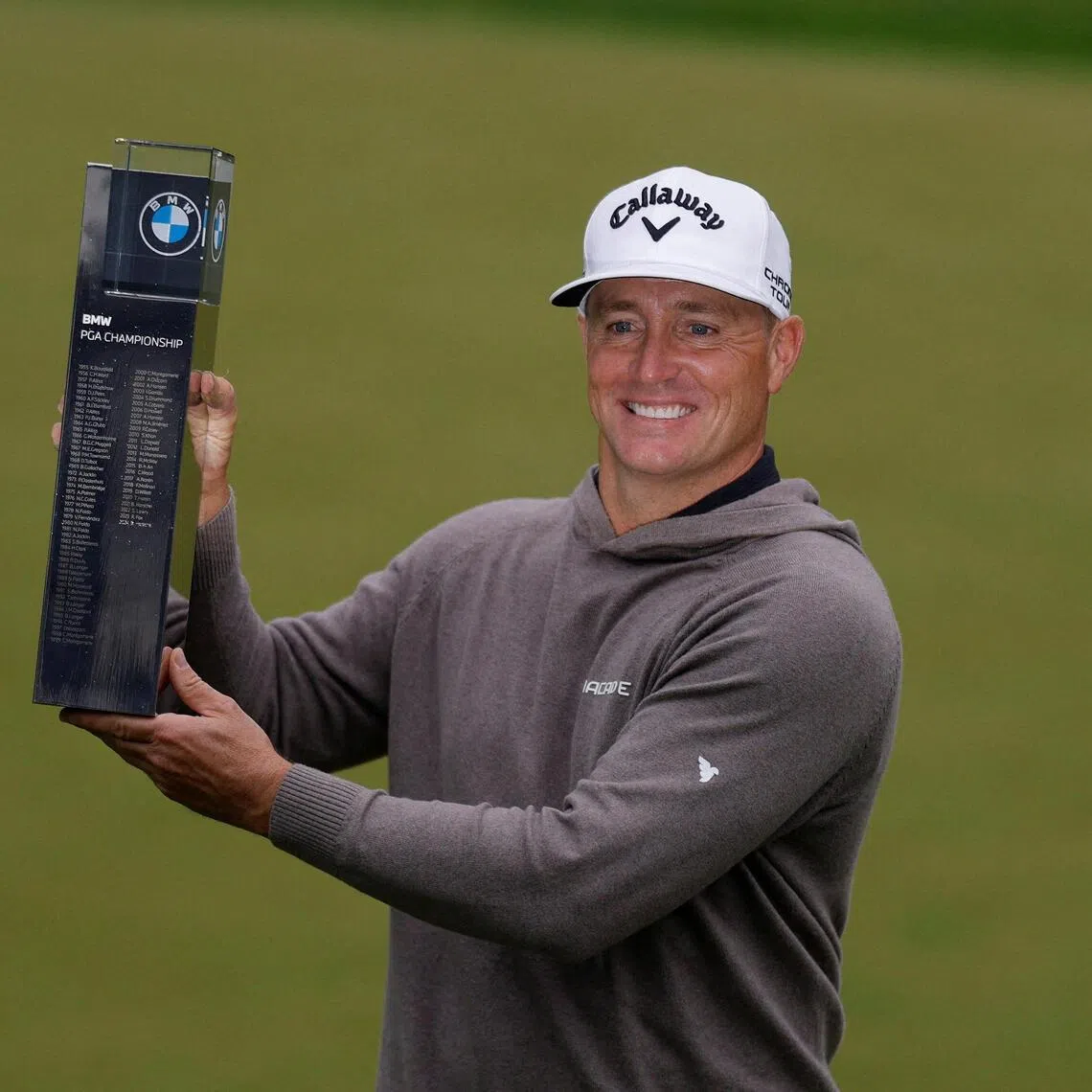 Sweden's Alex Noren celebrating with the trophy after winning the BMW PGA Championship at Wentworth Club, Virginia Water, in Britain on Sept 14, 2025.