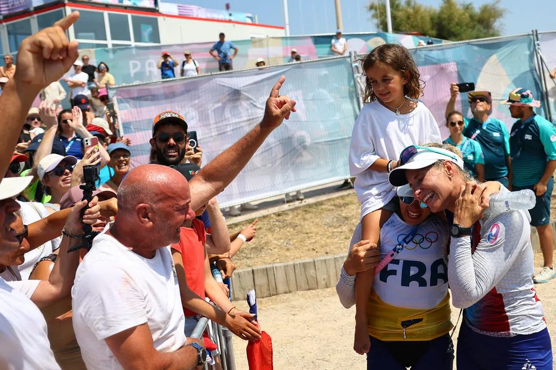 Paris 2024 Olympics - Sailing - Women's Skiff Medal Race - Marseille Marina, Marseille, France - August 02, 2024. Charline Picon of France and Sarah Steyaert of France celebrate after winning bronze. REUTERS/Luisa Gonzalez