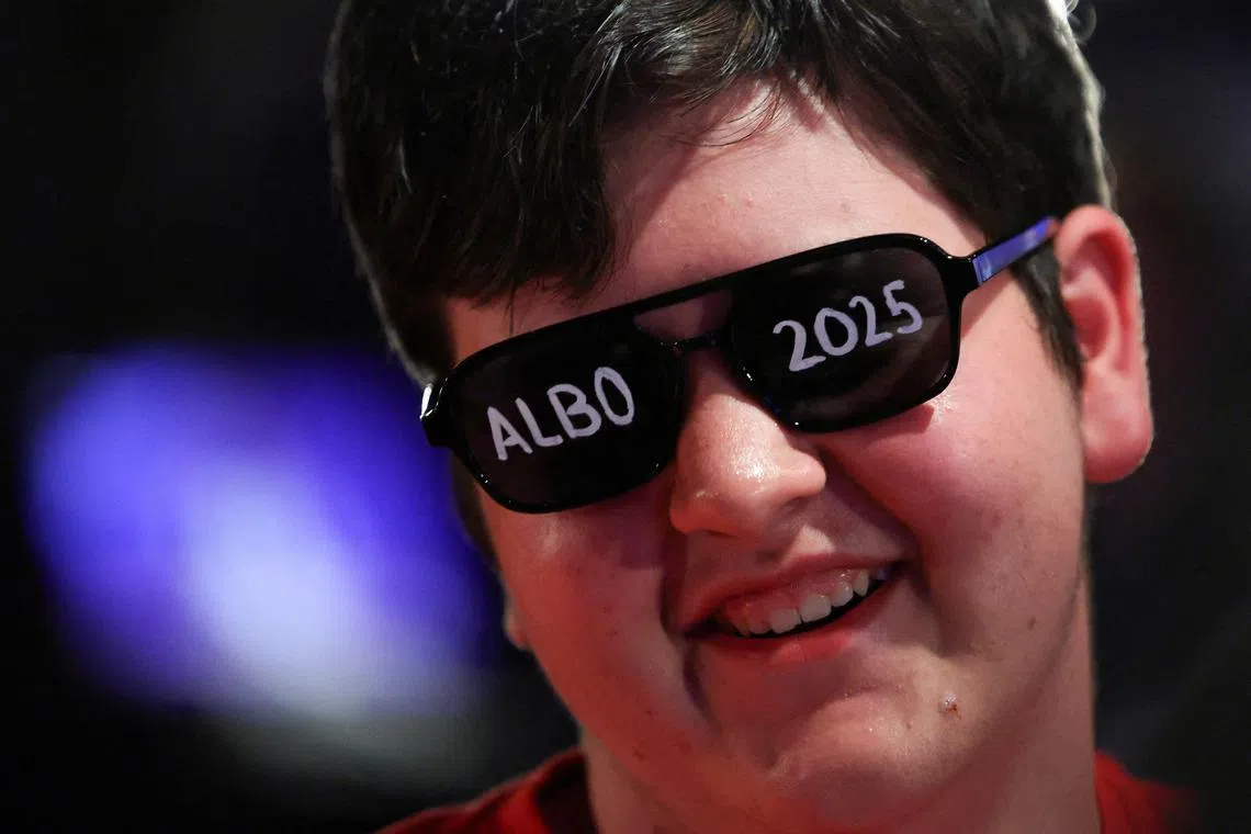 FILE PHOTO: A supporter of Australia's Prime Minister Anthony Albanese wears sunglasses with the words 'Albo 2025' written on it at a Labor party election night event on the day of the Australian federal election, in Sydney, Australia, May 3, 2025. REUTERS/Hollie Adams/File Photo