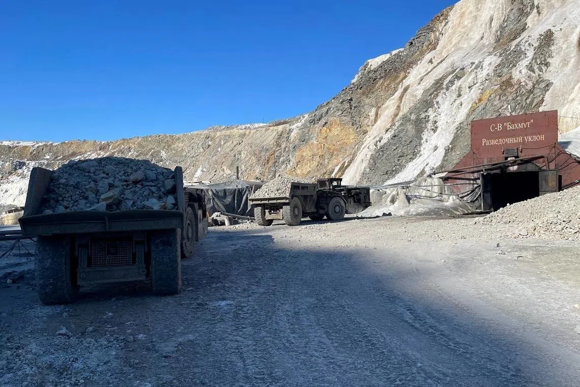 A view shows trucks during search and rescue operations at the Pioneer gold mine, where miners were trapped after a rock fall, in the Amur Region, Russia March 19, 2024. Russian Emergencies Ministry/Handout via REUTERS