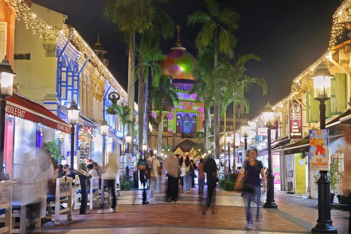 The Sultan Mosques' facade illuminated by a light show at the official opening of Kampong Glam Ramadan Bazaar on Feb 21.