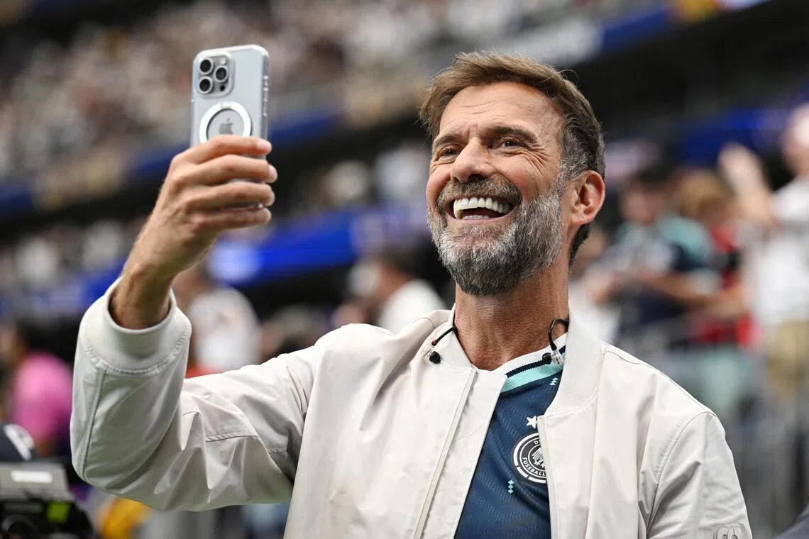 FILE PHOTO: Soccer Football - FIFA World Cup 2026 - Group E - Germany v Curacao - Houston Stadium, Houston, Texas, U.S. - June 14, 2026
Red Bull's Global Head of Soccer Juergen Klopp takes a photograph inside the stadium after the match REUTERS/Annegret Hilse/File Photo